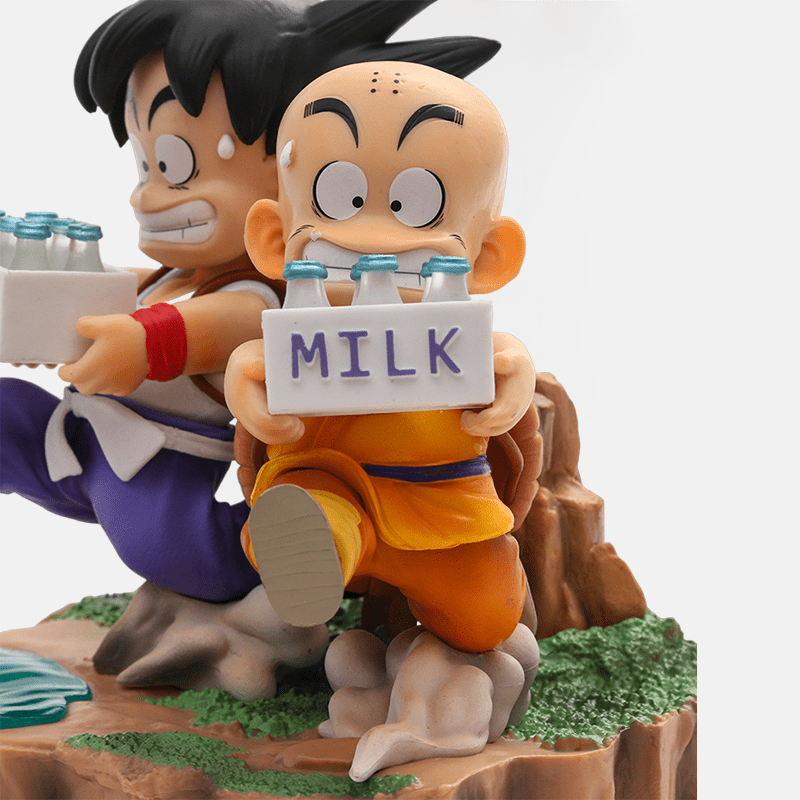 Figurine Son Goku et Krilin de Dragon Ball, reprenant la mémorable scène de livraison de lait sur l'île.