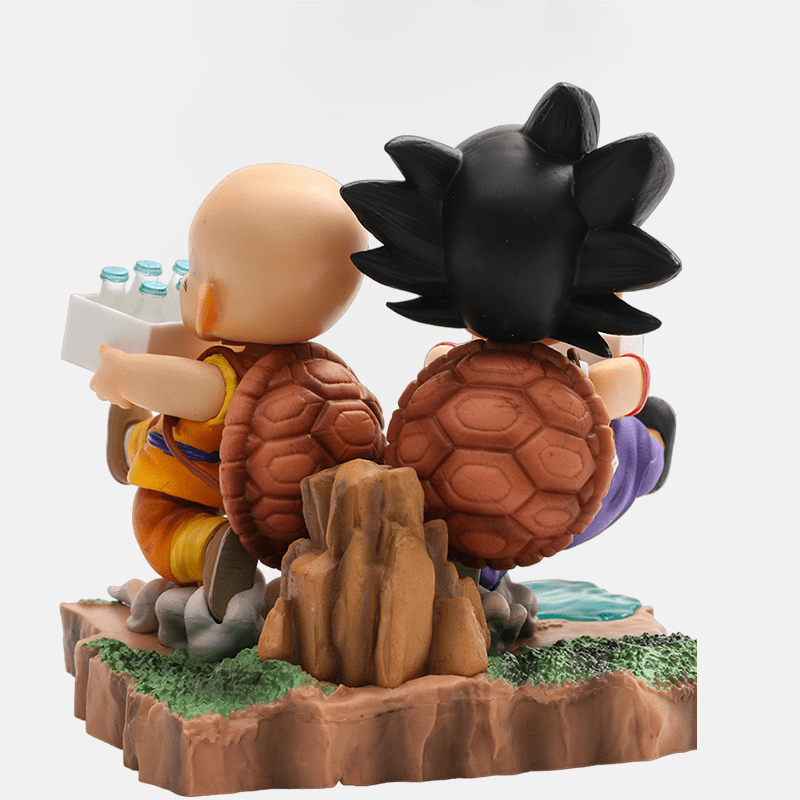 Figurine Son Goku et Krilin de Dragon Ball, reprenant la mémorable scène de livraison de lait sur l'île.