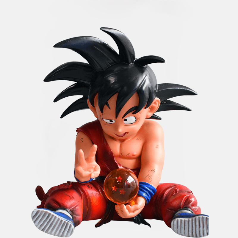 Ajoutez une touche de nostalgie à votre collection avec la figurine emblématique de Goku petit et sa boule de cristal de Dragon Ball.
