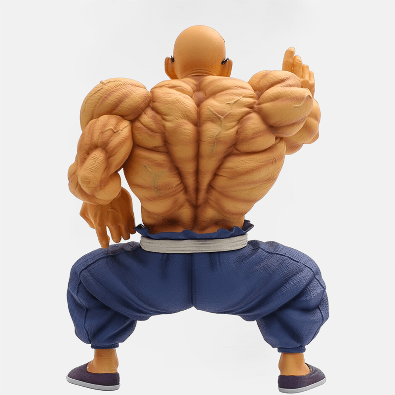 La figurine Tortue Géniale Musclé : le maître prêt au combat dans l'univers de Dragon Ball Z.