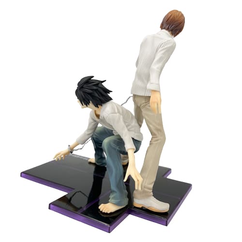 La figurine de L et Light Yagami incarne la confrontation légendaire entre le célèbre détective et le redoutable Kira de Death Note.
