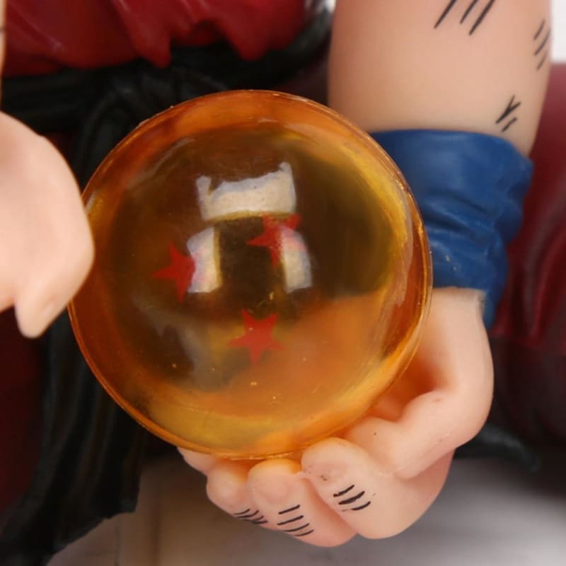 Obtenez la figurine de Son Goku enfant avec une boule de cristal du dragon Shenron, fidèle au manga Dragon Ball Z, de 10 cm de hauteur, pour revivre les aventures de ce célèbre héros.