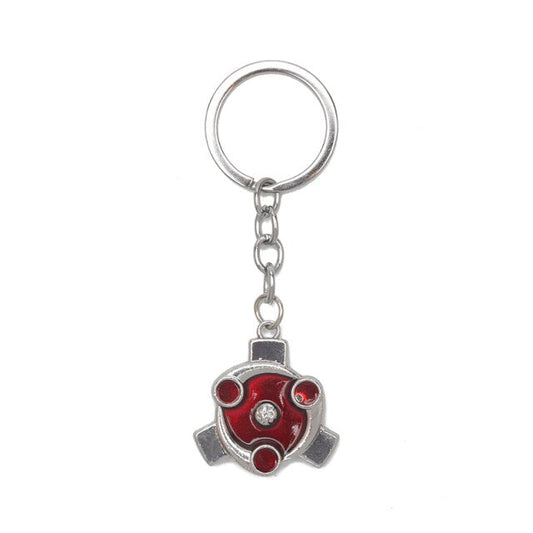 Donnez une touche Ninja à vos clés avec ce porte-clé Naruto en alliage de zinc représentant le Sharingan de Madara Uchiwa, l'accessoire parfait pour les fans du manga !